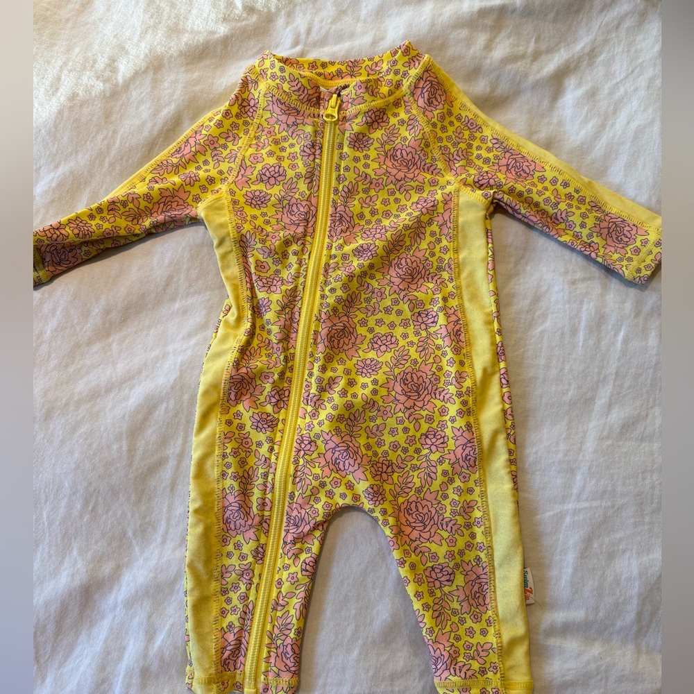 Swim Zip spf 50 0-6 month sun bathing suit. Full protection. Cutest pattern.